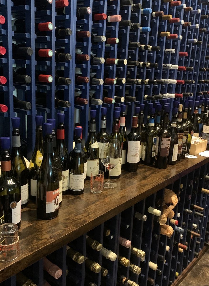 A restaurant wine wall with Repour on open bottles